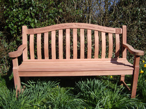 Celtic knot carving into wood on memorial bench