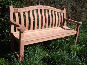 Celtic knot carving into wood on memorial bench