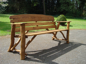 Heart symbol carved into wood on a memorial bench - 4mb2330