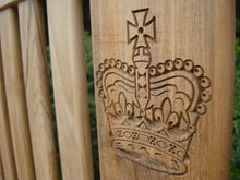 Load image into Gallery viewer, English Crown carved into wood on a commemorative bench - 4mb1704