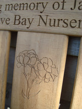 Load image into Gallery viewer, Carnation flower carved into wood on a memorial bench - 4mb2950