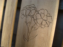 Load image into Gallery viewer, Carnation flower carved into wood on a memorial bench - 4mb2950