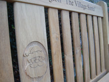 Load image into Gallery viewer, Father Christmas carving into wood on a memorial bench - 4mb2129