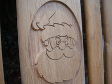 Load image into Gallery viewer, Father Christmas carving into wood on a memorial bench - 4mb2129