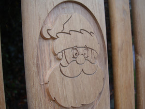 Father Christmas carving into wood on a memorial bench - 4mb2129