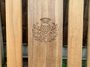 Thistle carved on Kenilworth teak memorial bench